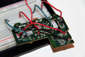 The circuit board with new leads, connected to a breadboard.