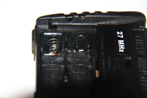 The existing battery leads in the remote. The spring for the negative lead needs to be compressed to pull out the circuit board.